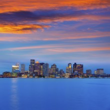 Boston skyline at sunset and river reflection in Massachusetts USA