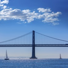 San Francisco Bay bridge sailboat from Pier 7 in California USA