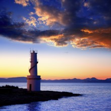 Ibiza island sunset of Es Vedra and La Savina lighthouse in Formentera
