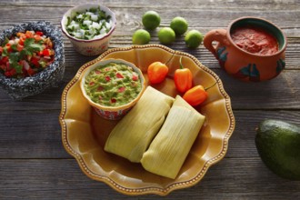 Mexican Tamale tamales of corn leaves with chili and sauces