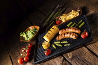 Grilled krakauer with french fries and green salad
