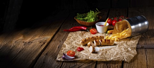 Rustic bratwurst with pommes and hot ketchup