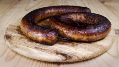 Fried Sausages On a Wooden Board