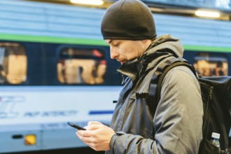 Train Station in Sopot, Poland, Europe. Attractive man waiting at the train station. Thinking about
