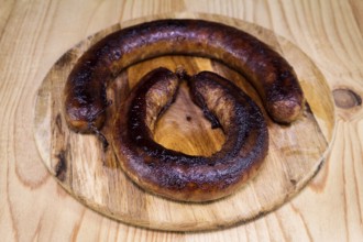 Fried Sausages On a Wooden Board