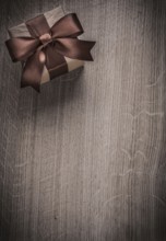 Vintage present box on wooden board holiday concept copyspace