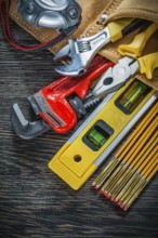 Building belt with construction tooling on wooden board