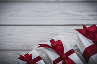 Gift boxes on wooden board holidays concept