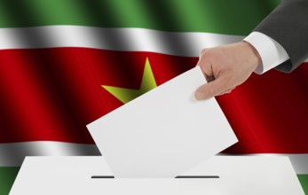 The Surinam flag and the hand with the bulletin about the ballot box