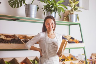 Portrait of woman seller in the grocery shop. Zero waste and raw food concept