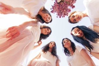 Happy young bridesmaids looking down together. Happy Hen party