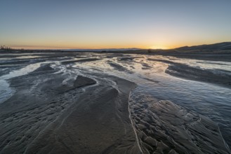 Sunset over shallow Medano Creek disappearing in sand - Great Sand Dunes National Park, Colorado
