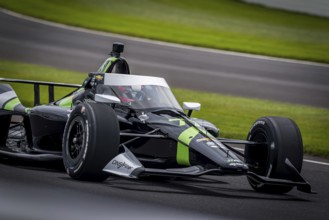 ROMAIN GROSJEAN (77) of Geneva, Switzerland comes off turn 3 during a practice for the 108th