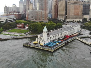 Aerial view of Battery Park pier A leading to Liberty Island, people can be seen waiting in line