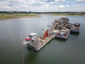Gravel and sand extraction at the river Rhine using a gravel extractor