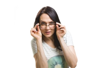 Woman with raised glasses cannot see, against a white background