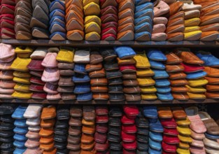 Fez, Morocco, 4 March, 2024: detail view of shelves full of colourful leather shoes and slippers in