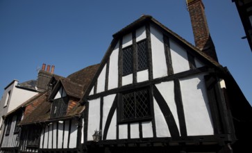 Wooden house roof attics against clear blue sky. Home residential building. Traditional british