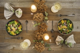 Christmas menu with salad with field salad, walnuts, orange fillets and radicchio