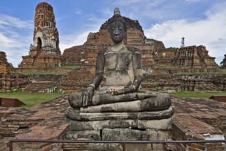 Wat Phra Mahathat temple complex in Ayutthaya on a sunny day