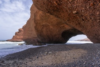 A view of the beach and rock arch at Legzira on the Atlantic Coast of Morocco