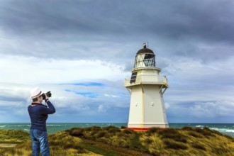 Independent trip to New Zealand. The snow-white lighthouse of Waipapa is visible on the horizon.