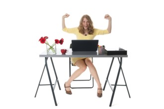Young woman is happy with the message at the laptop
