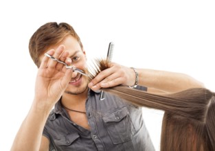 Professional hairdresser with long hair model, in front of white background