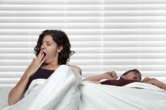 Young married couple waking upin the morning