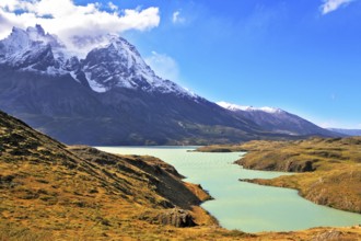 Asure Lake Pehoe water at the foot of the magnificent snow-covered cliffs of Los Kuernos. National