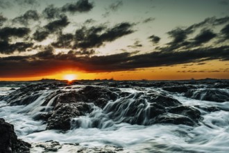 Wild waves crashing on rocks during a dramatic sunset, Tenerife, Canary Islands, Spain, Europe