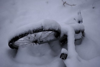 Germany, Berlin, 14.02.2025, Mauerpark, snow-covered bicycle, Europe