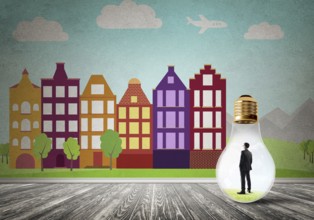 Businessman inside light bulb against city drawn concept