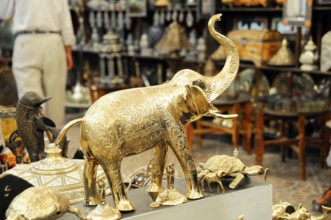 Brass figures at a market, including an elephant and other animal sculptures, Fez, northern