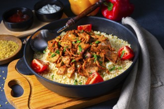 Rustic Wulgur pans with gratinated gyros and yoghurt