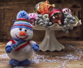 Photo knitted from wool figurine Christmas snowman