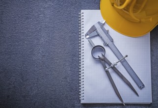 Notebook building helmet drawing compass slide caliper construction concept
