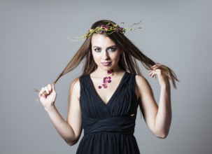 Girl with fashion make up and dry roses petals natural tattoo