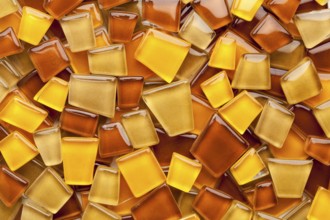 Random background of yellow, brown and amber glass mosaic tiles