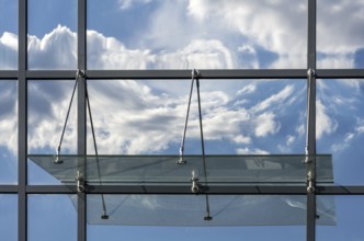 Clouds reflected on the house facade