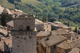 Wide panoramic view over downtown San Gimignano, Torre del Diavolo in the center, seen from Torre