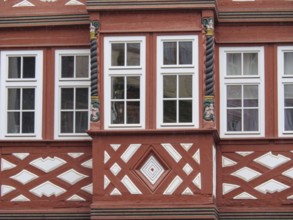 Half-timbered façade with red struts, spiral columns and decorative geometric patterns, Mainz,