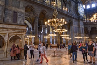 Tourists inside Hagia Sophia, former Orthodox cathedral and Ottoman imperial mosque, in Istanbul,