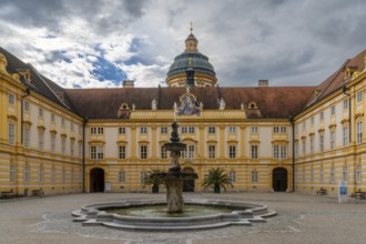 Melk, Austria, 22 September, 2022: view of the courtyard and fountain at the entrance of Melk Abbey