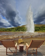 Pillar of hot water and steam from forcing its way out of the ground. Geyser Strokkur in Iceland.
