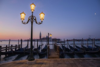 Dawn, Venetian gondolas with the church of San Giorgio Maggiore in the background, Venice, UNESCO