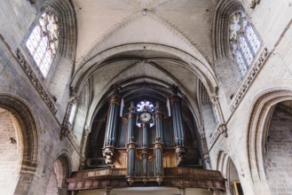 Vannes, France, August 6, 2018: Pipe organ and vaults of the Cathedral of Vannes. It is a Roman