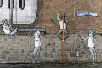 Large wall graffiti on the brick wall of buildings in Craenendonck Street, Leuven, Flanders,