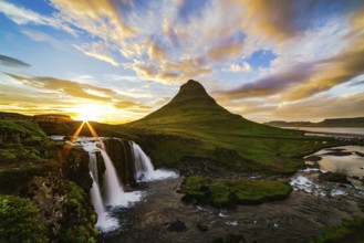 View of mount Kirkjufell and Kirkjufellfoss in Iceland at sunset