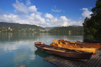 Typical wooden boats at the pier of the Bled Island, Lake Bled, Slovenia, Europe